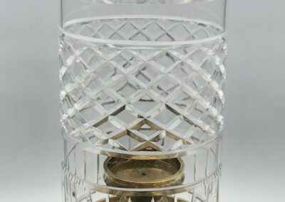 Cut glass vase with intricate patterns.