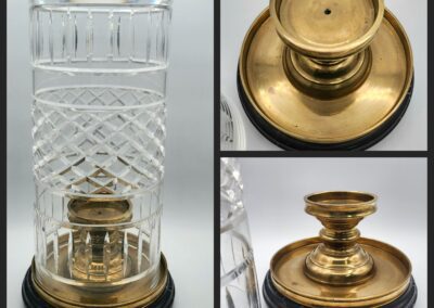 Crystal vase with brass and wood base.