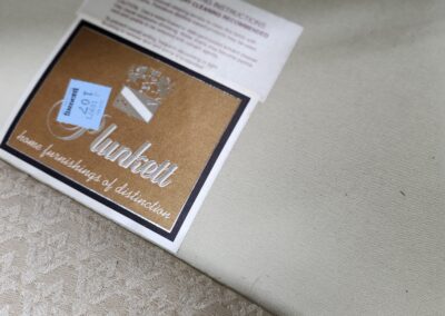 Fabric swatch with label and textured pattern.