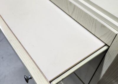 Drawer with partially extended sliding shelf.