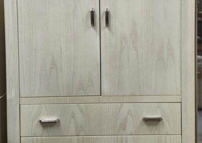 Wooden wardrobe with drawers and doors.