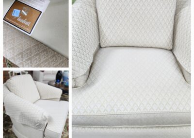 White upholstered armchair with diamond pattern.