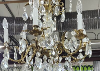 Elegant crystal chandelier with gold accents.