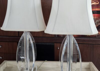 Two crystal lamps with white shades.