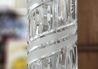 Glass lamp base with spiral design.