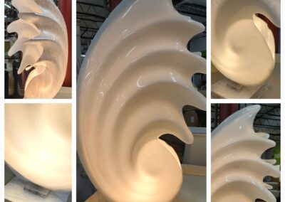 Abstract shell-shaped white sculpture collage.