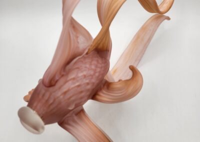 Glass sculpture resembling a swimming goldfish.