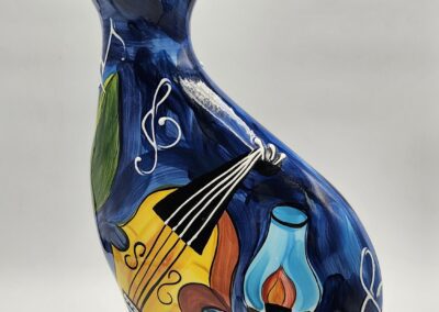 Colorful ceramic cat with musical design.