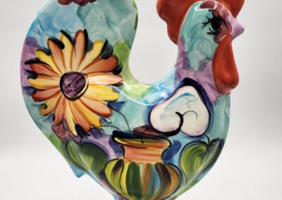 Colorful ceramic rooster with floral design.