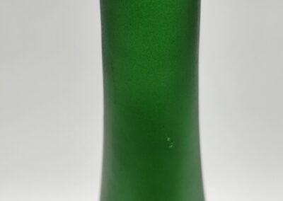 Tall green frosted glass bottle, white background.