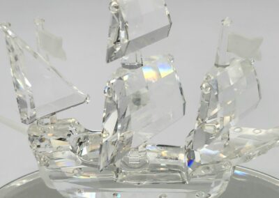 Crystal ship figurine with multiple sails.