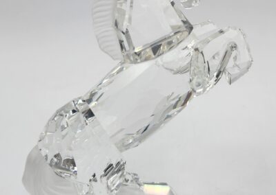 Crystal horse figurine rearing on hind legs.
