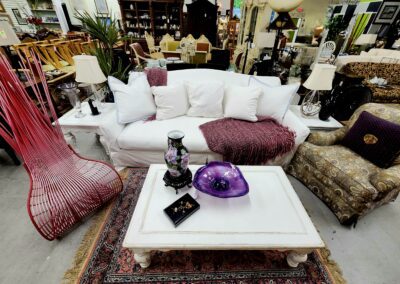 Furniture showroom with sofa and decorative items.