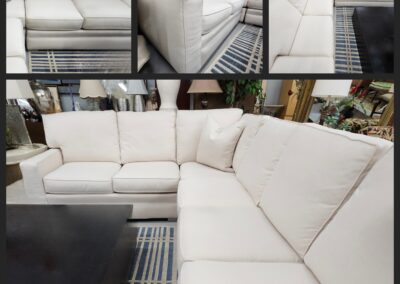 White sectional sofa in living room setting.
