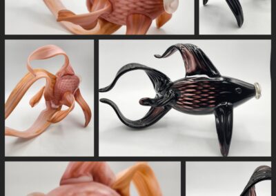 Glass fish sculptures in various colors and designs.