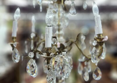 Crystal chandelier with ornate hanging pendants.