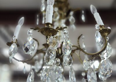 Elegant crystal chandelier with candle-shaped bulbs.