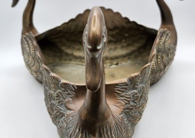 Bronze swan-shaped decorative bowl with handles.