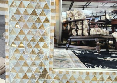 Mosaic frame with furniture in the background.