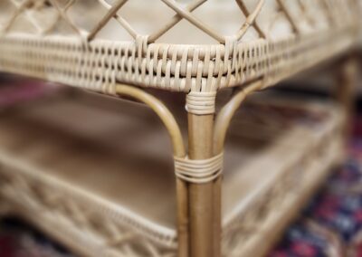 Rattan table with intricate weaving design.