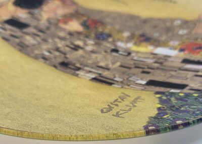 Decorative plate with Gustav Klimt artwork.