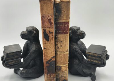 Monkey bookends with vintage books in between.