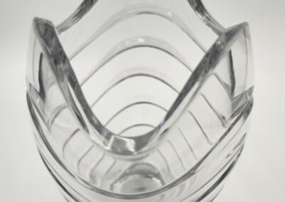 Elegant glass vase with wavy edges.