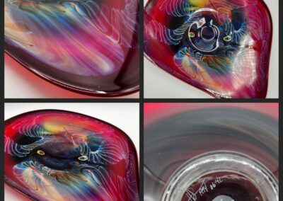 Colorful abstract glass art with swirling patterns.