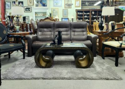 Furniture showroom with sofa and decorative table.