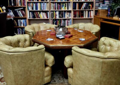Cozy library with chairs and round table.