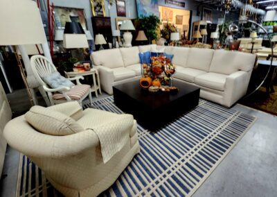 Furniture showroom with sofas and decorative items.
