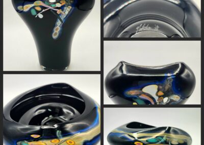 Black abstract glass sculptures with colorful patterns.