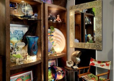 Decorative shelves with art and mirror display.