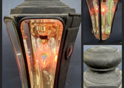 Vintage lantern with glowing orange light.