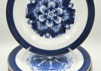 Stack of blue and white floral plates.