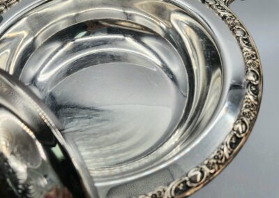 Ornate silver bowl with decorative edges.