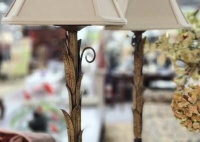 Two decorative lamps with white shades.