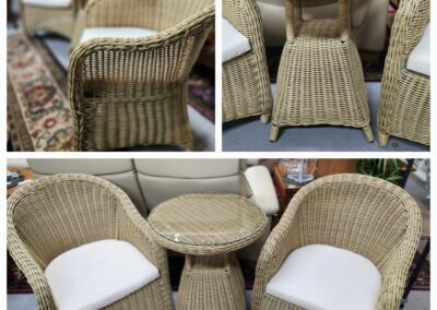 Wicker chairs and table with cushions.