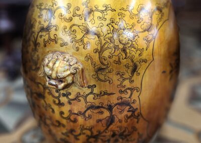 Ornate ceramic vase with intricate floral patterns.
