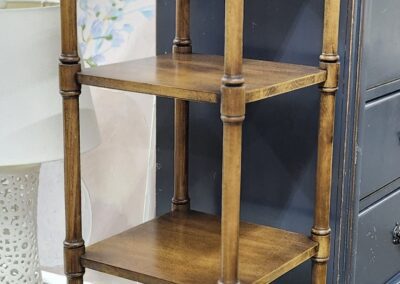 Wooden five-tier corner shelf with arches.