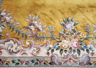 Ornate floral carpet with intricate patterns.