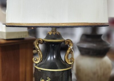 Ornate table lamp with decorative vase base.