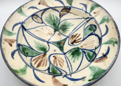Decorative ceramic plate with floral design.