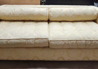 Yellow patterned sofa in a living room.