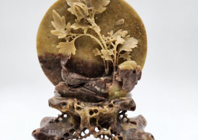 Stone sculpture with intricate floral design.