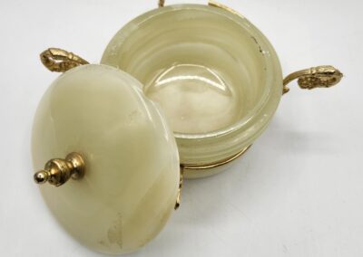 Ornate jade box with gold handles, open.