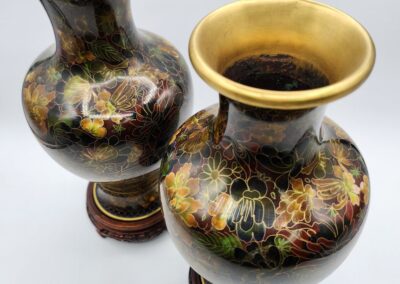 Two ornate vases with floral designs.