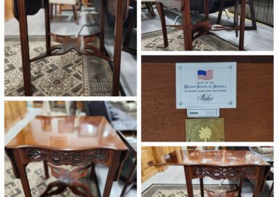 Wooden table with intricate carving details.