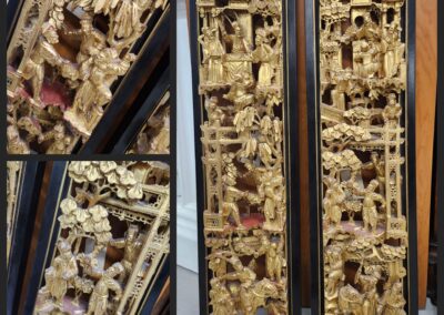 Ornate wooden carvings in gold frames.