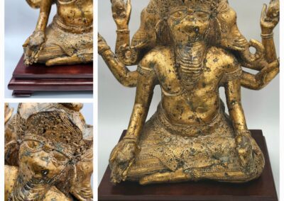 Golden statue of a multi-armed deity.